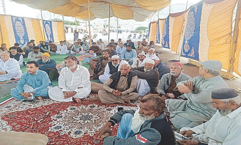 Supporters and workers of a multiparty alliance participate in a sit-in on Marine Drive in Gwadar.—Photo by the writer