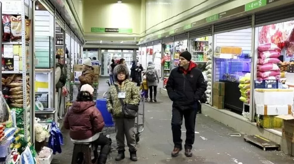 Row of stalls selling Vietnamese food at Sadovod market in Moscow, Russia.