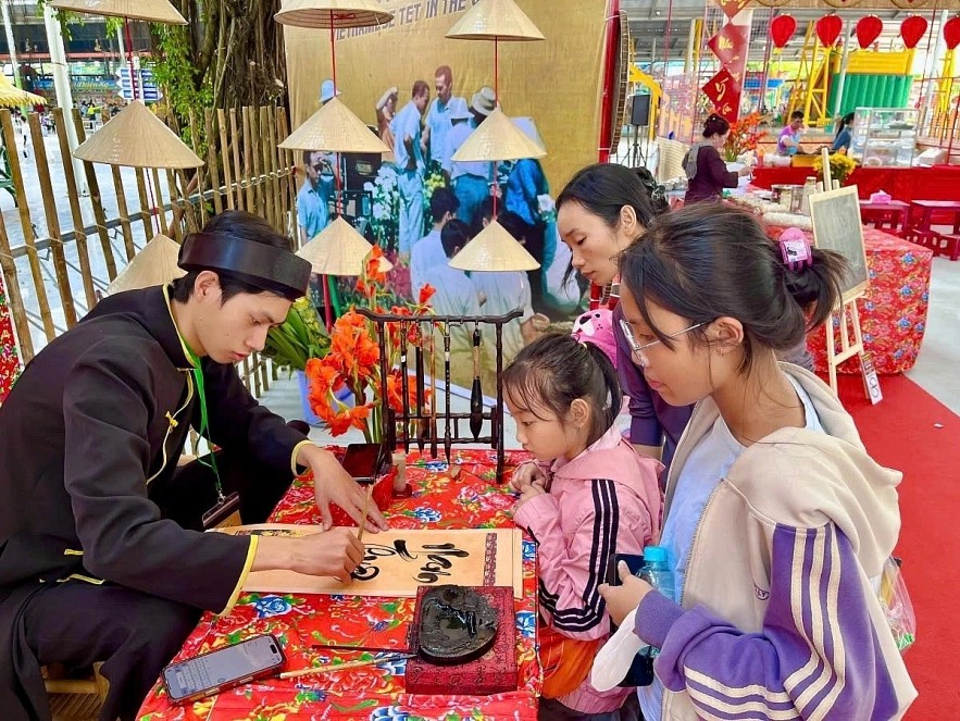 Asking for lucky scripts at Suoi Tien Cultural Tourism Park.