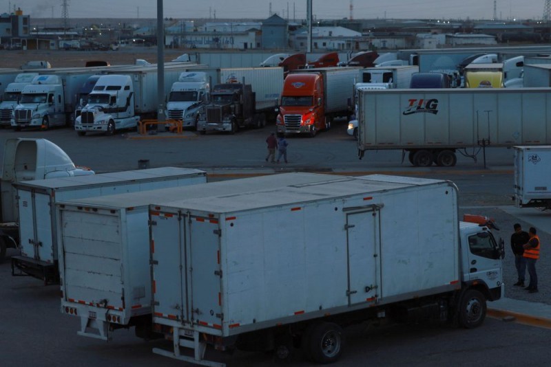 Trucks sit idle in a parking lot on the outskirts of Ciudad Juarez, Mexico, on March 5 as Mexican businesses temporarily halt exports to the United States, waiting for tariffs to be lifted. (Photo: Reuters)