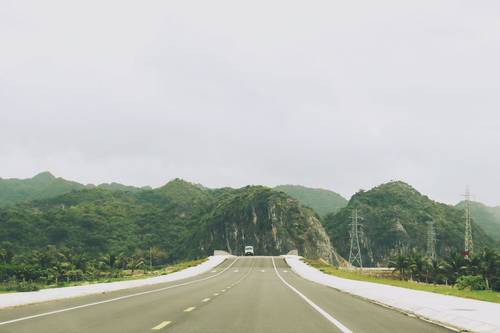 Coastal road in Cat Ba Island, a 'not-to-be-missed' destination for backpackers