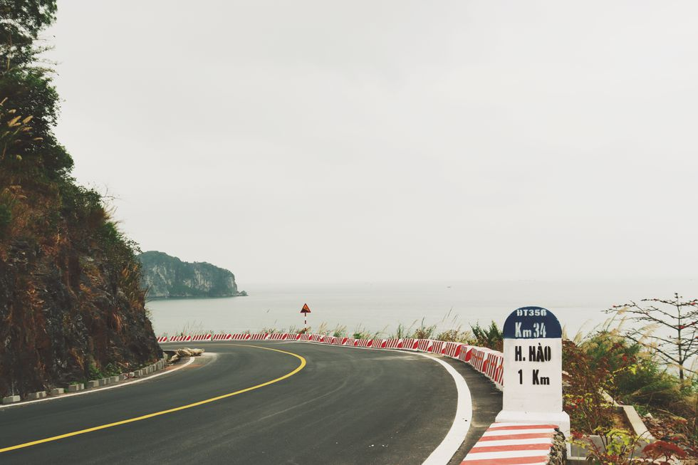 Coastal road in Cat Ba Island, a 'not-to-be-missed' destination for backpackers