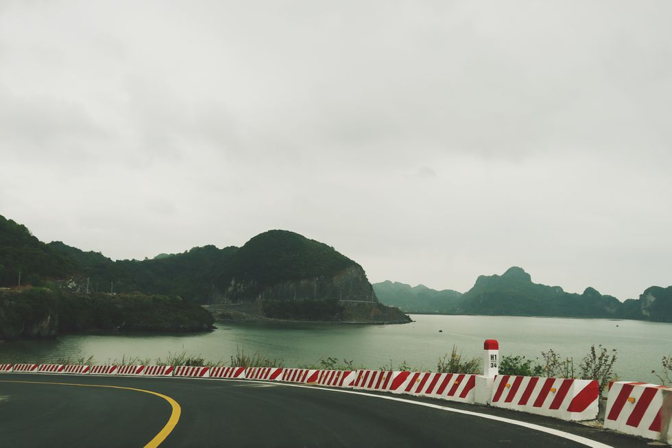 Coastal road in Cat Ba Island, a 'not-to-be-missed' destination for backpackers