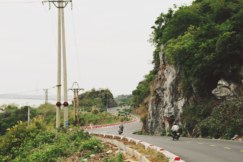 Coastal road in Cat Ba Island, a 'not-to-be-missed' destination for backpackers