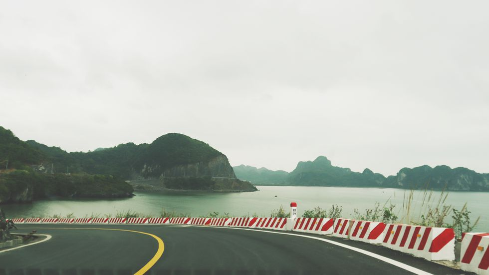 Coastal road in Cat Ba Island, a 'not-to-be-missed' destination for backpackers