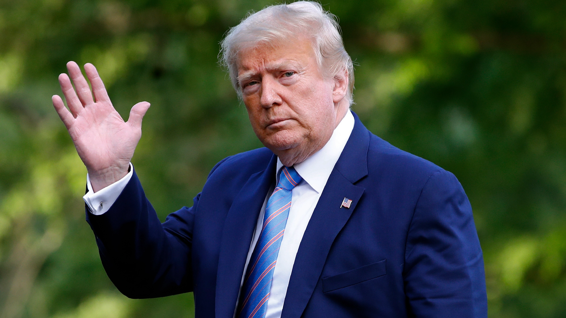 President Donald Trump walks on the South Lawn of the White House in Washington