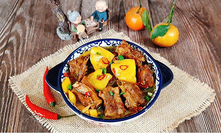 traditional recipe of young ribs braised with pineapple for tet holiday