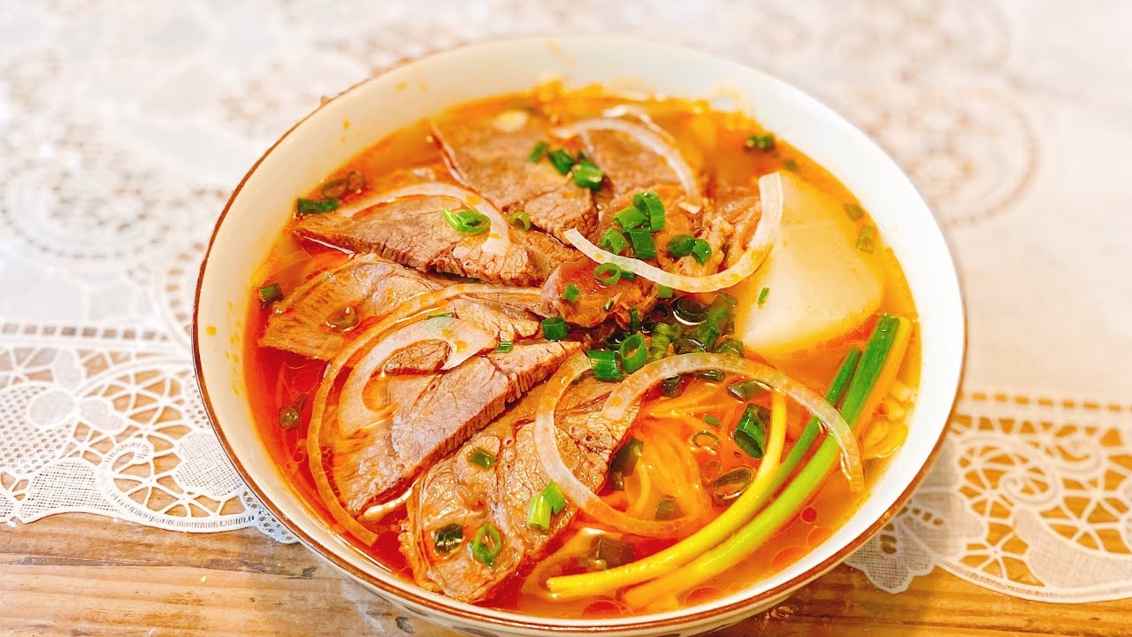 Homemade recipe for 'Bun Bo Hue' (Hue style beef noodle soup) with popular ingredients