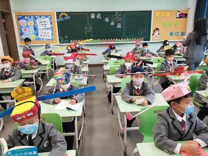 chinese primary students return schools with self made distancing hats