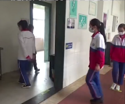chinese primary students return schools with self made distancing hats