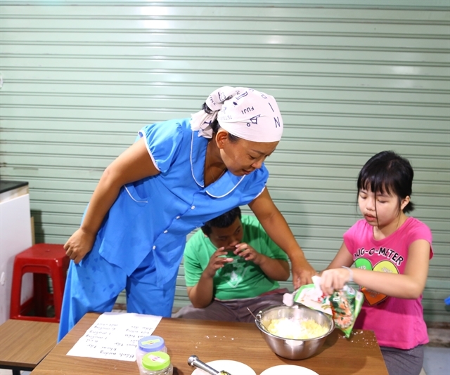 japanese teacher bridges gap with vietnamese children with autism