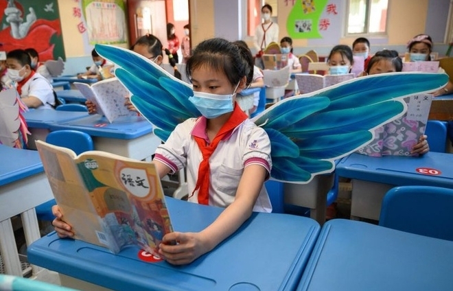 Chinese students wear adorable ‘social distancing wings’ at school