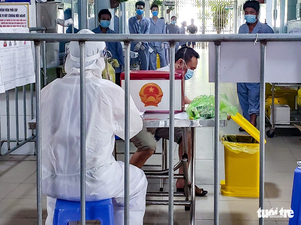 In photos: Covid-19 patients vote for NA seats in field hospital