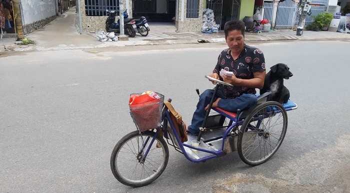 dog with lottery tickets on mouth helps handicapped owner earn a livelihood