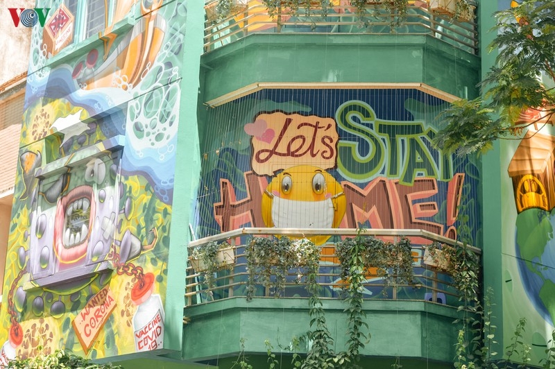 artful masion in hanoi with covid 19 themed propoganda graffiti catches attention