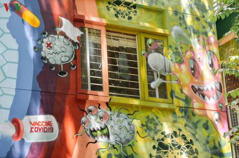 artful masion in hanoi with covid 19 themed propoganda graffiti catches attention