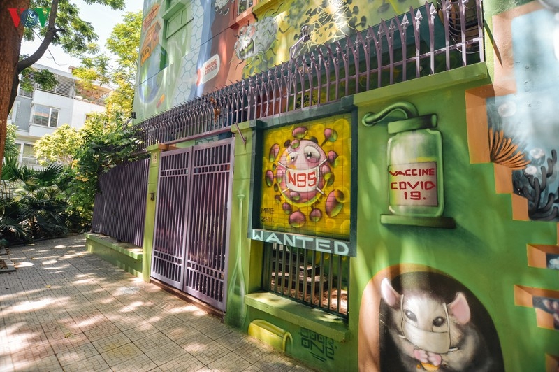 artful masion in hanoi with covid 19 themed propoganda graffiti catches attention