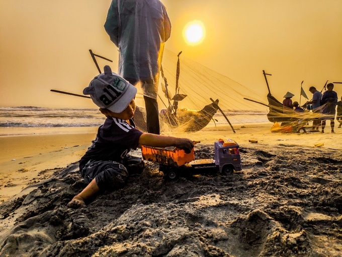 One kid playing by the sea