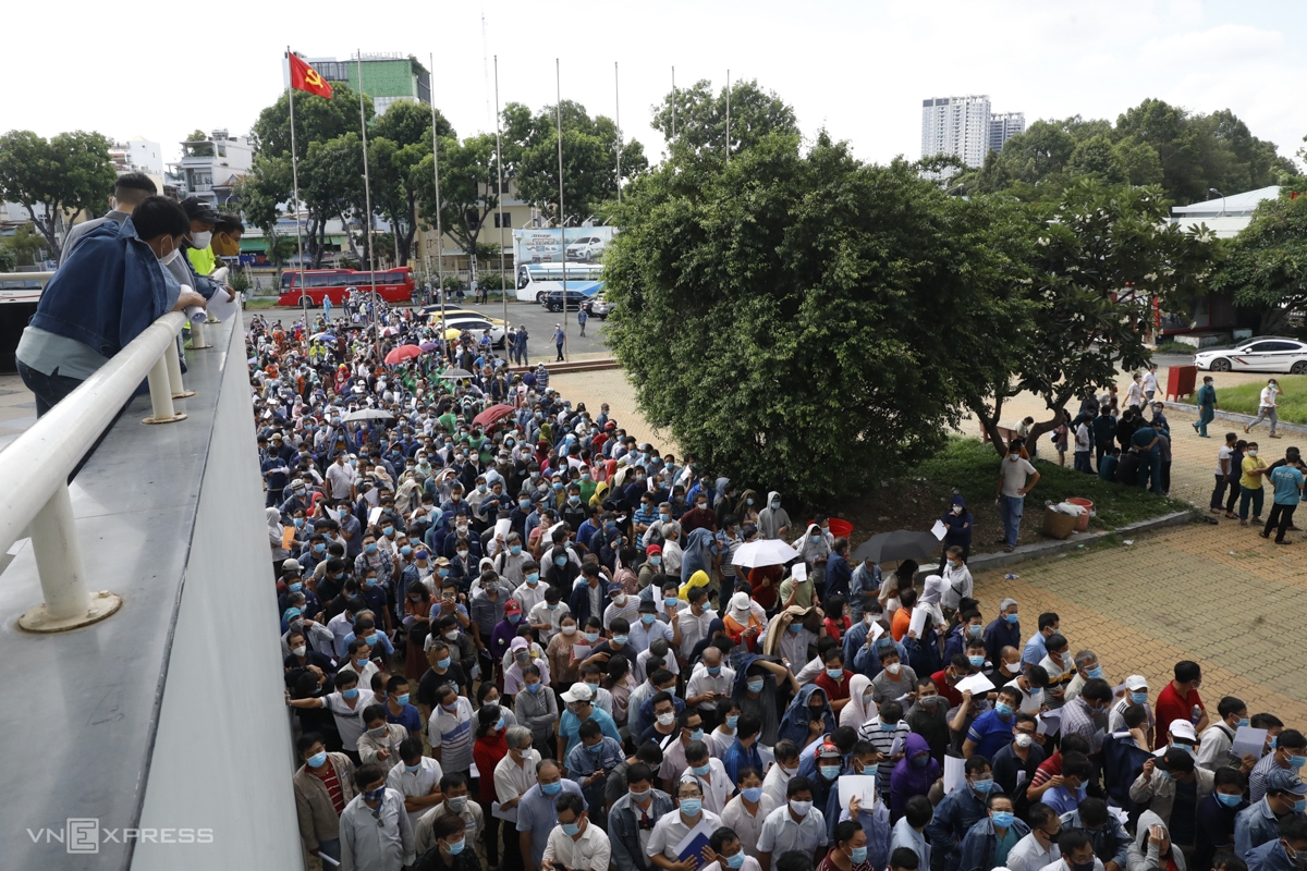 Ho Chi Minh City reports record 1 day increase in Covid cases, Hanoi eases preventive measures