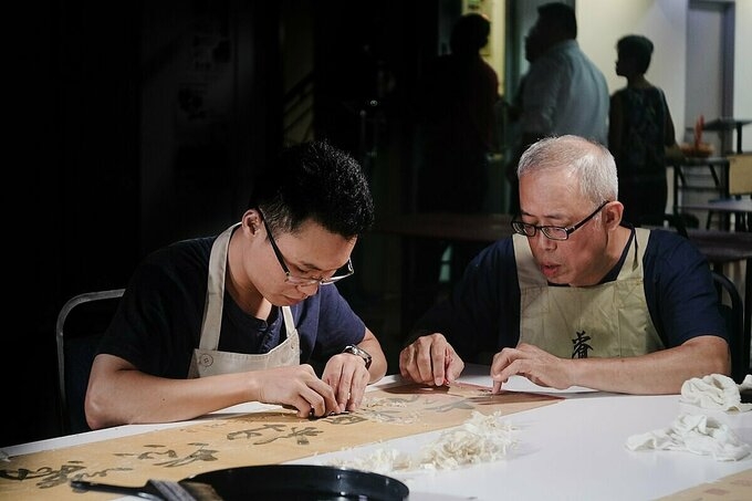 With heavily-damaged books, Phuc has to use expensive chemicals imported from foreign countries