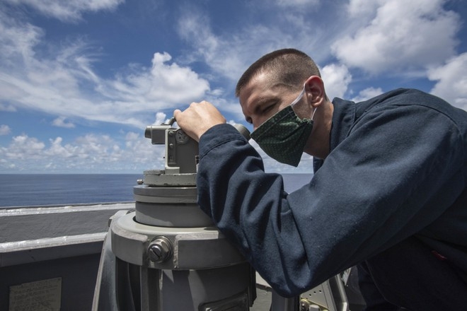 A sailor spotted on the uss ralph johnson while sailing near spratly islands july 14