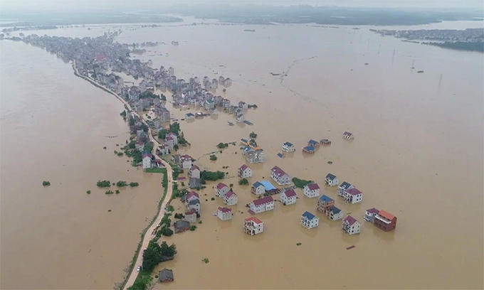 Inundated buildings and vehicles in Shexian County, Huangshan City, Anhui Province, China