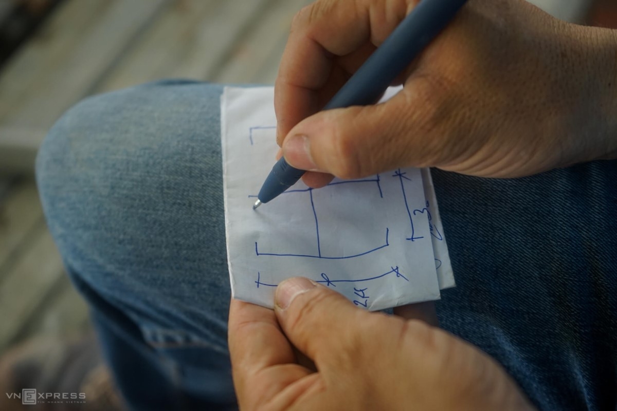 An engineer drawing a blueprint of room 