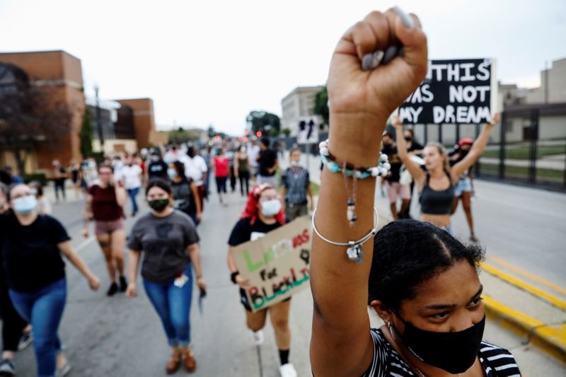 About 1,000 people joined a mile-long march in Kenosha, Wisconsin on Saturday