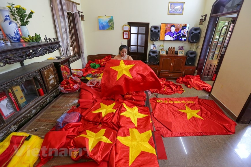 The village with 75 year tradition of embroidering national flags