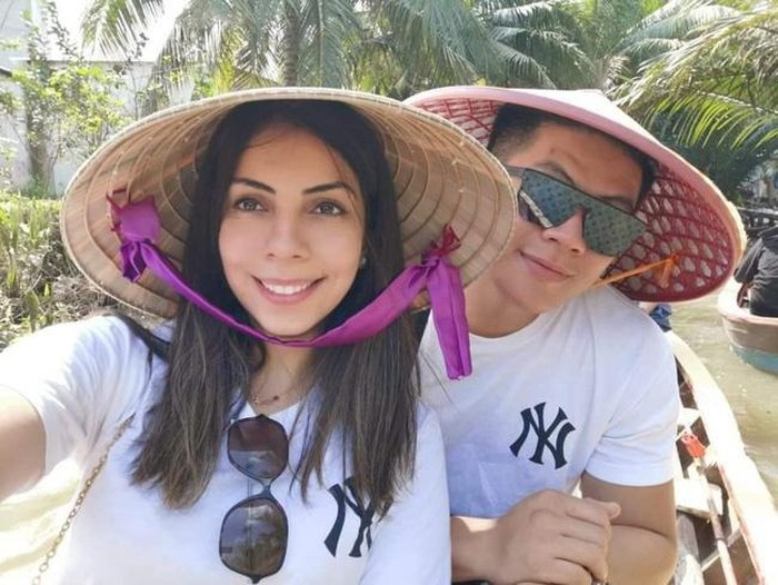 Tho and jubran first met each other at technical university of sydney. in the photo, both are wearing conical hat, traditional hat vietnam 