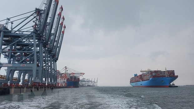  Super large container ship Margrethe Maersk prepares to dock at Cai Mep International Terminal.  (Photo: VNA)