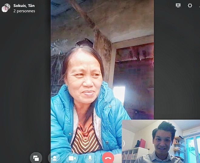 Tan in a video chat with his birth mother (Photo: Thanh Nien)  