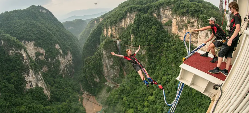 A visitor takes a bungee jump from  Zhangjiajie Glass Bridge (Photo: China highlights)  