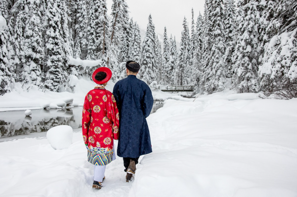 Vietnamese - Polish couple wearing Nguyen Dynasty costume for snowy wedding pictures in Canada