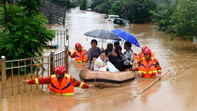 china flood updates thousands trapped after levees fail dams at risk of breaking