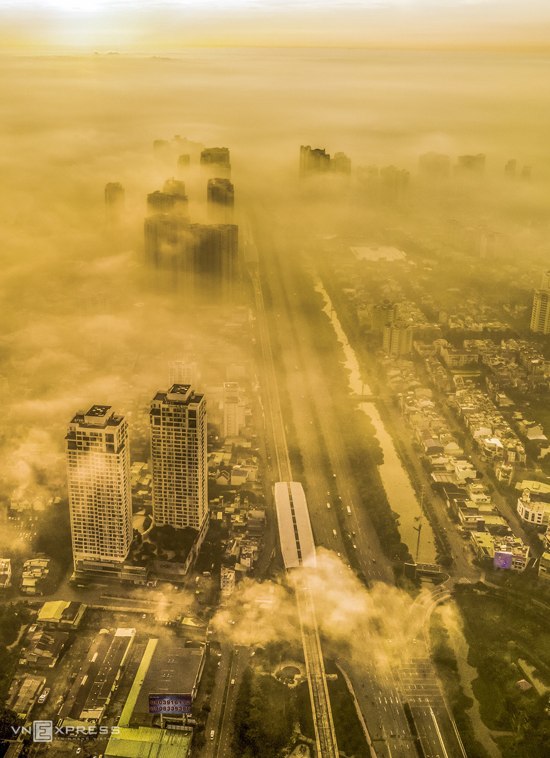 a dreamy saigon under cloud and fog