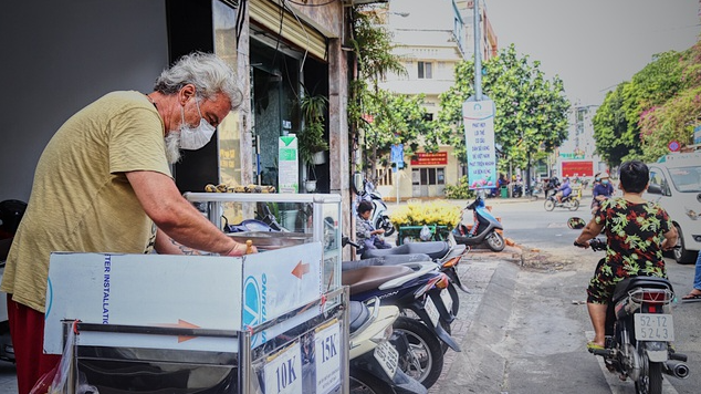 stranded in vietnam french tourist sells street food to earn living during covid 19