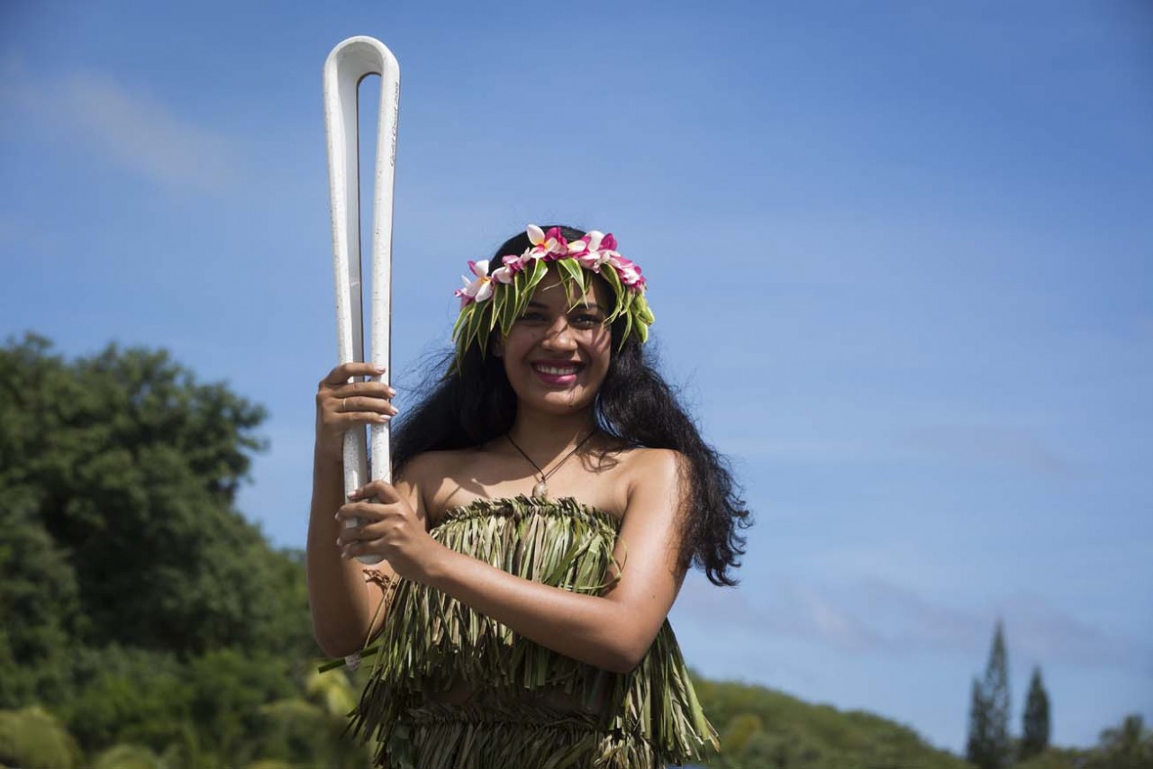 A local Batonbearer with the Queen's Baton during a day-long relay around the island. Photo: Gold Coast 2018 