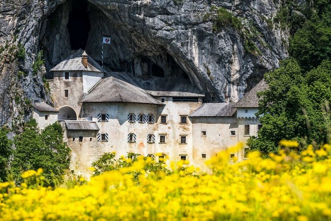 Behind Predjama Castle: The Largest Fairytale Castle Embraced by Rock