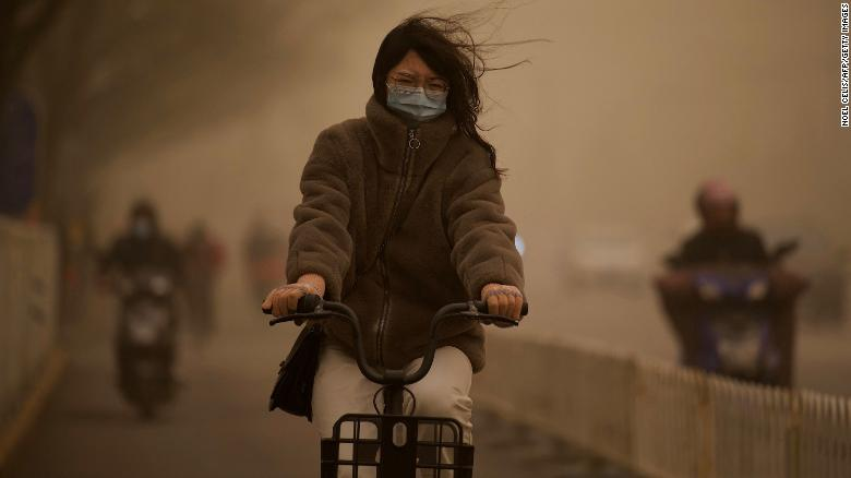 Sandstorm covers Beijing in orange dust, and pollution send readings off the scale