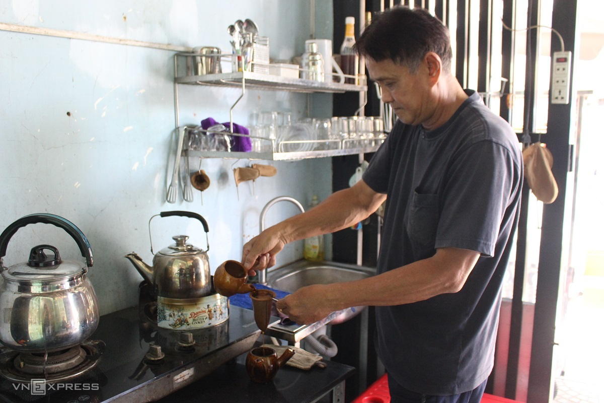 old style racket coffee with ceramic pots in saigon