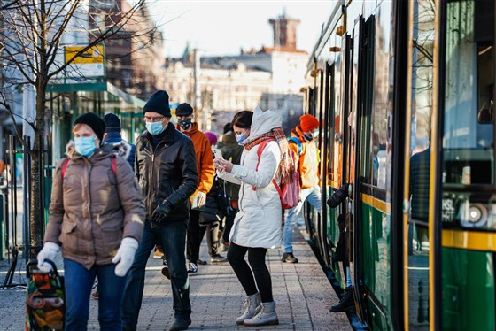 Commuters at a tram stop in Helsinki, Finland, on March 8.Roni Rekomaa / Bloomberg via Getty Images file