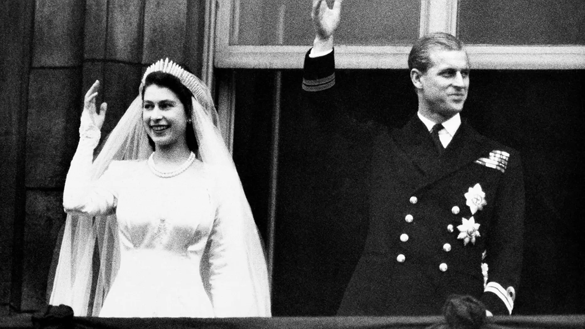 In this Nov. 20, 1947 file photo, Britain's Princess Elizabeth and her husband the Duke of Edinburgh wave to the crowds on their wedding day, from the balcony of Buckingham Palace in London. Buckingham Palace officials say Prince Philip, the husband of Queen Elizabeth II, has died, it was announced on Friday, April 9. (AP)