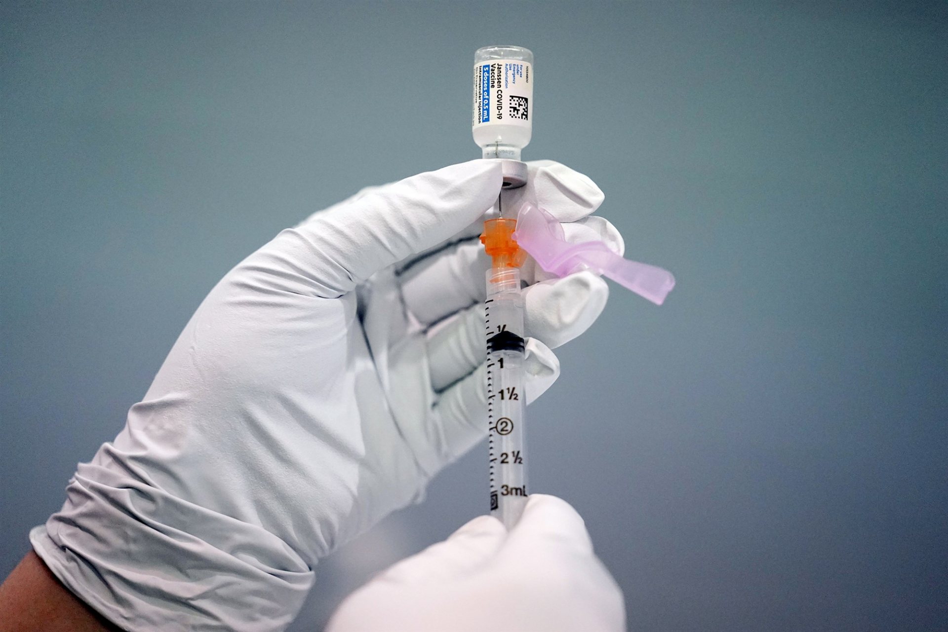 A member of the Philadelphia Fire Department prepares a dose of the Johnson & Johnson Covid-19 vaccine at a vaccination site at a Salvation Army location in Philadelphia, on March 26, 2021.Matt Rourke / AP file