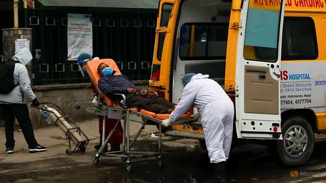 A patient suffering from COVID-19 is transferred from an ambulance as a second coronavirus wave surges in Kathmandu, Nepal, May 4, 2021. (Photo: REUTERS/Navesh Chitrakar)