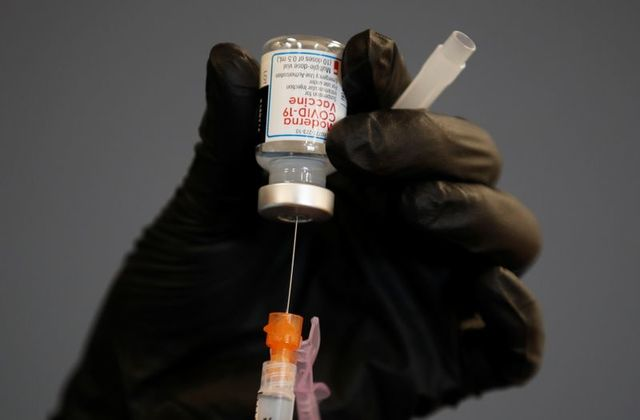 A health care worker fills a syringe with Moderna COVID-19 vaccine as California opens up vaccine eligibility to any residents 16 years and older during the outbreak of coronavirus disease (COVID-19) in Chula Vista, California, U.S., April 15, 2021. REUTERS/Mike Blake