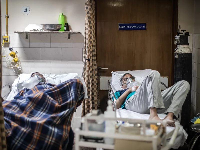 COVID-19 patients in the emergency ward of an unidentified hospital on Monday in New Delhi. Dr. Sumit Ray, a hospital critical care chief in the city, says India's health care system is collapsing. Rebecca Conway/Getty Images