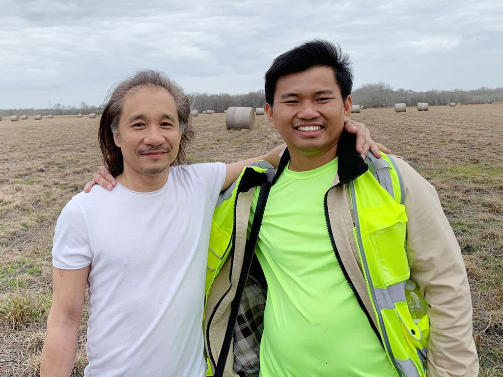 Vuong and billionaire Charlie Ton Quy at Vuong's farm (Photo: Thanh Nien) 