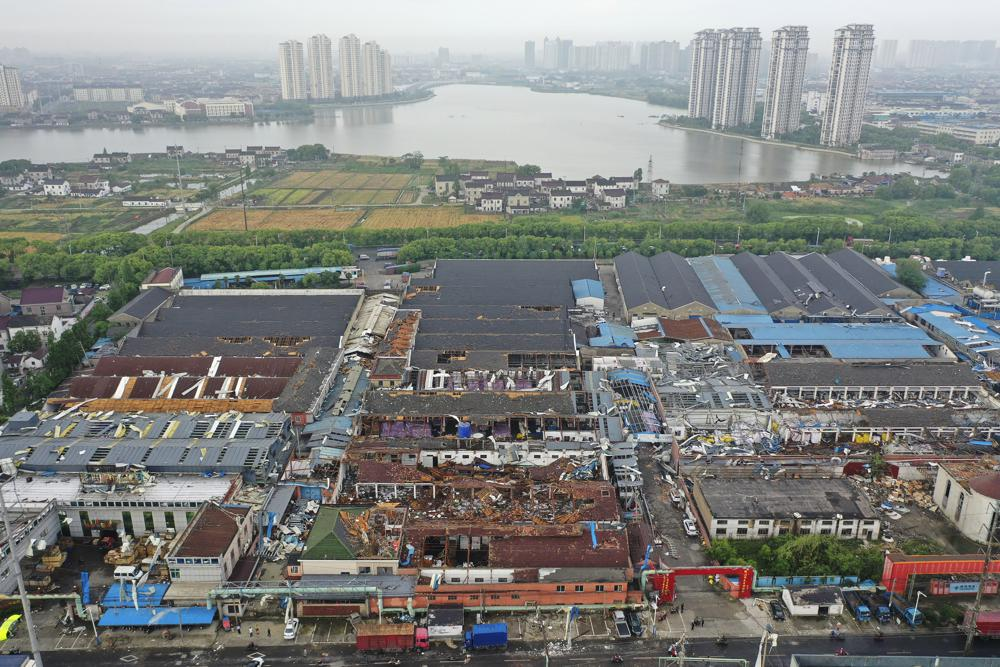 Damage to buildings from a reported tornado is seen in an aerial view in Shengze township in Suzhou in eastern China's Jiangsu Province, Saturday, May 15, 2021. Two tornadoes killed several people in central and eastern China and left hundreds of others injured, officials and state media reported Saturday. (Chinatopix via AP)
