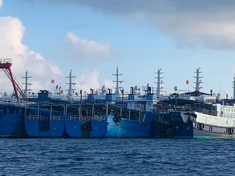 Chinese vessels, believed to be manned by Chinese maritime militia personnel, are seen in the Philippines’ EEZ on March 27, 2021 [File: Philippine Coast Guard/National Task Force-West Philippine Sea/Handout via Reuters]